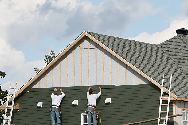 Professional Siding technician working in Newport, OR